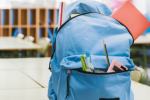 blue-schoolchild-backpack-table